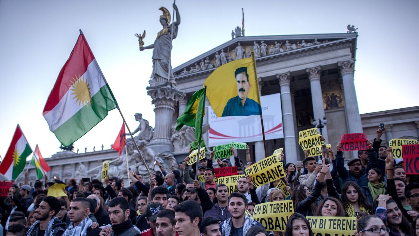 Pro Kurdish supporters march by Austrian Parliament as approximately 2000 thousand people attended a protest in Vienna on October 10, 2014 to show solidarity for Syrian Kurds who are fighting to defend the Syrian-Turkey border town of Kobane from Islamic State (Isis) militants. AFP PHOTO / JOE KLAMAR (Photo credit should read JOE KLAMAR/AFP via Getty Images)